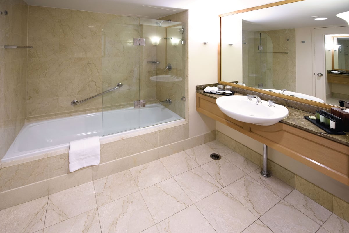 combined shower/bathtub, deep-soaking bathtub, designer toiletries