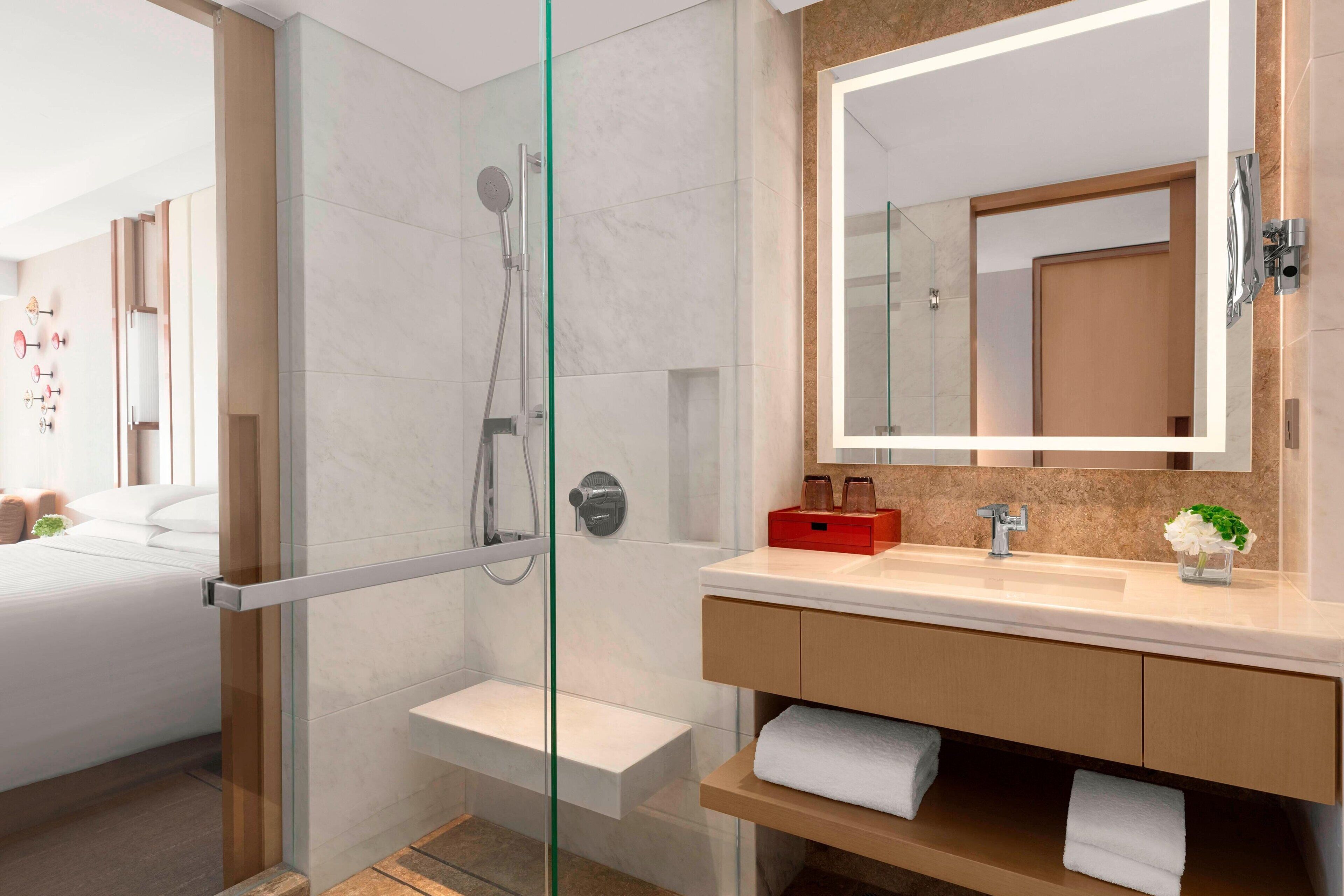 designer toiletries, hair dryer, dressing gowns, slippers