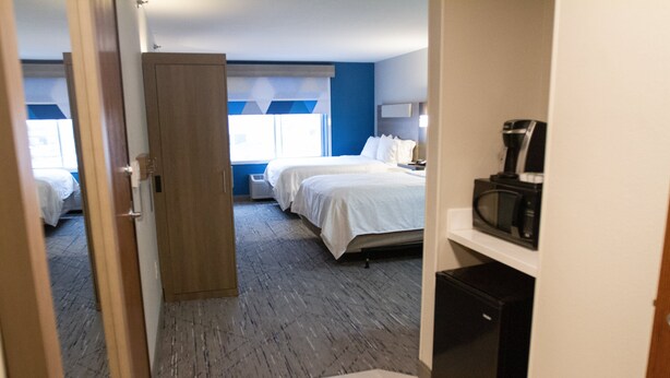 A hotel room with two beds, a coffee machine, and a small refrigerator. - Holiday Inn Express Oneill by IHG (O'Neill)