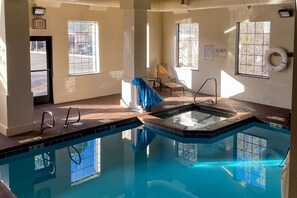 Indoor pool, open 7:00 AM to 10:00 PM, pool loungers