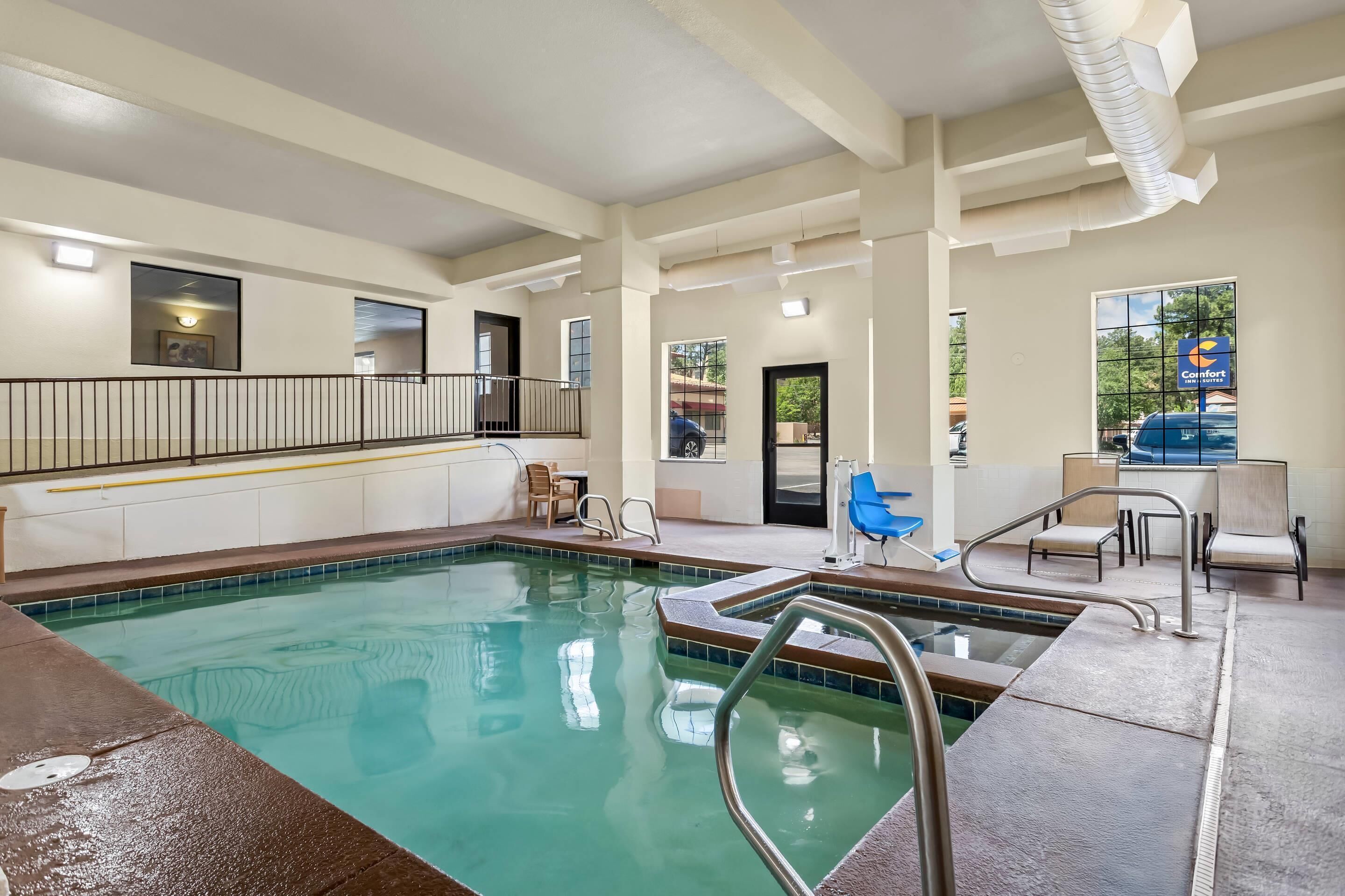 Indoor pool, open 7:00 AM to 10:00 PM, pool loungers