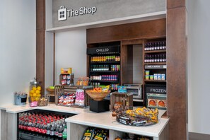 A store interior with a variety of snacks, beverages, and a refrigerated section labeled 'CHILLED'. - Hilton Garden Inn Charlotte Uptown (Charlotte)