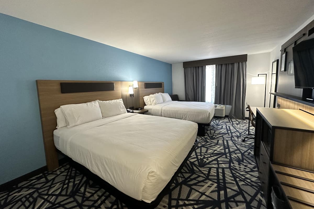 Desk, blackout drapes, iron/ironing board, rollaway beds