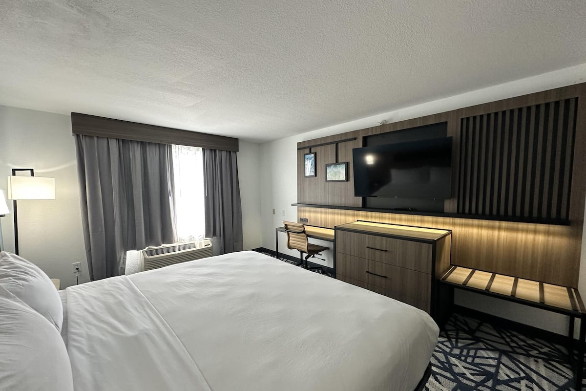 Desk, blackout drapes, iron/ironing board, rollaway beds