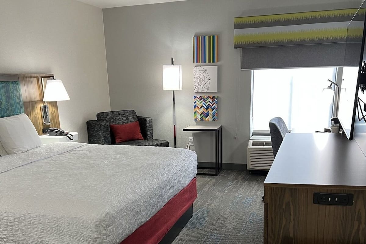 Desk, laptop workspace, blackout curtains, iron/ironing board
