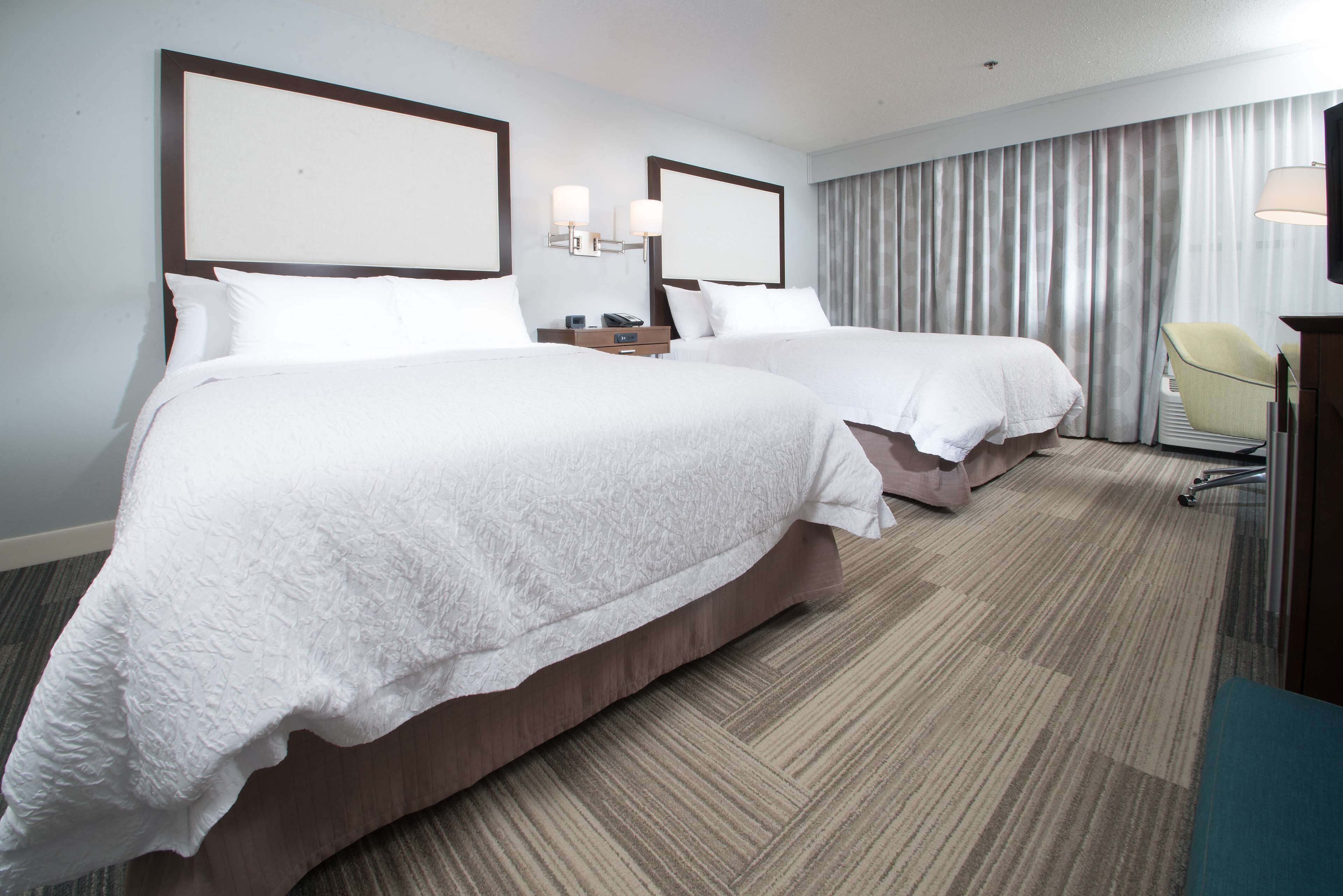 room, 2 queen beds, non smoking | in-room safe, iron/ironing board, cots/infant beds, free wifi