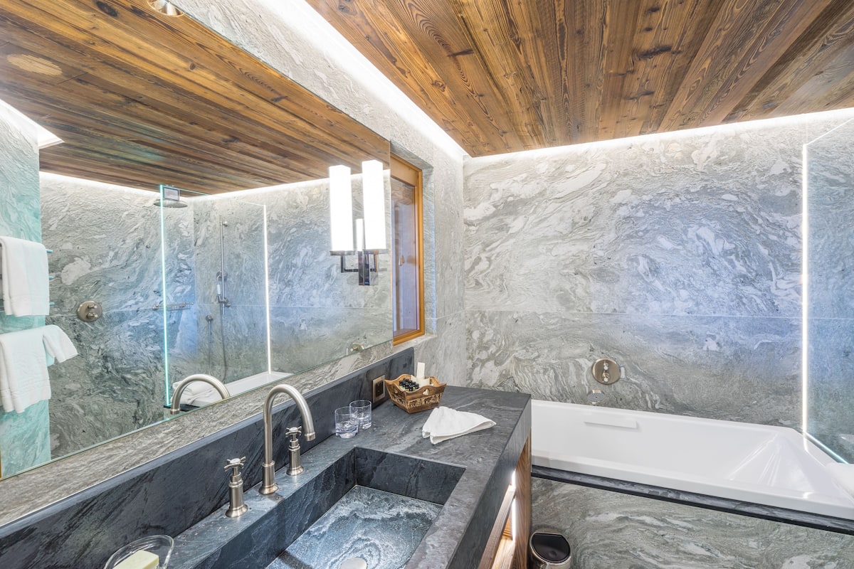 Designer toiletries, hair dryer, bathrobes, slippers