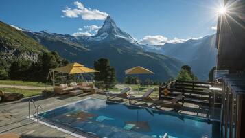 Indoor pool, outdoor pool, pool umbrellas, sun loungers