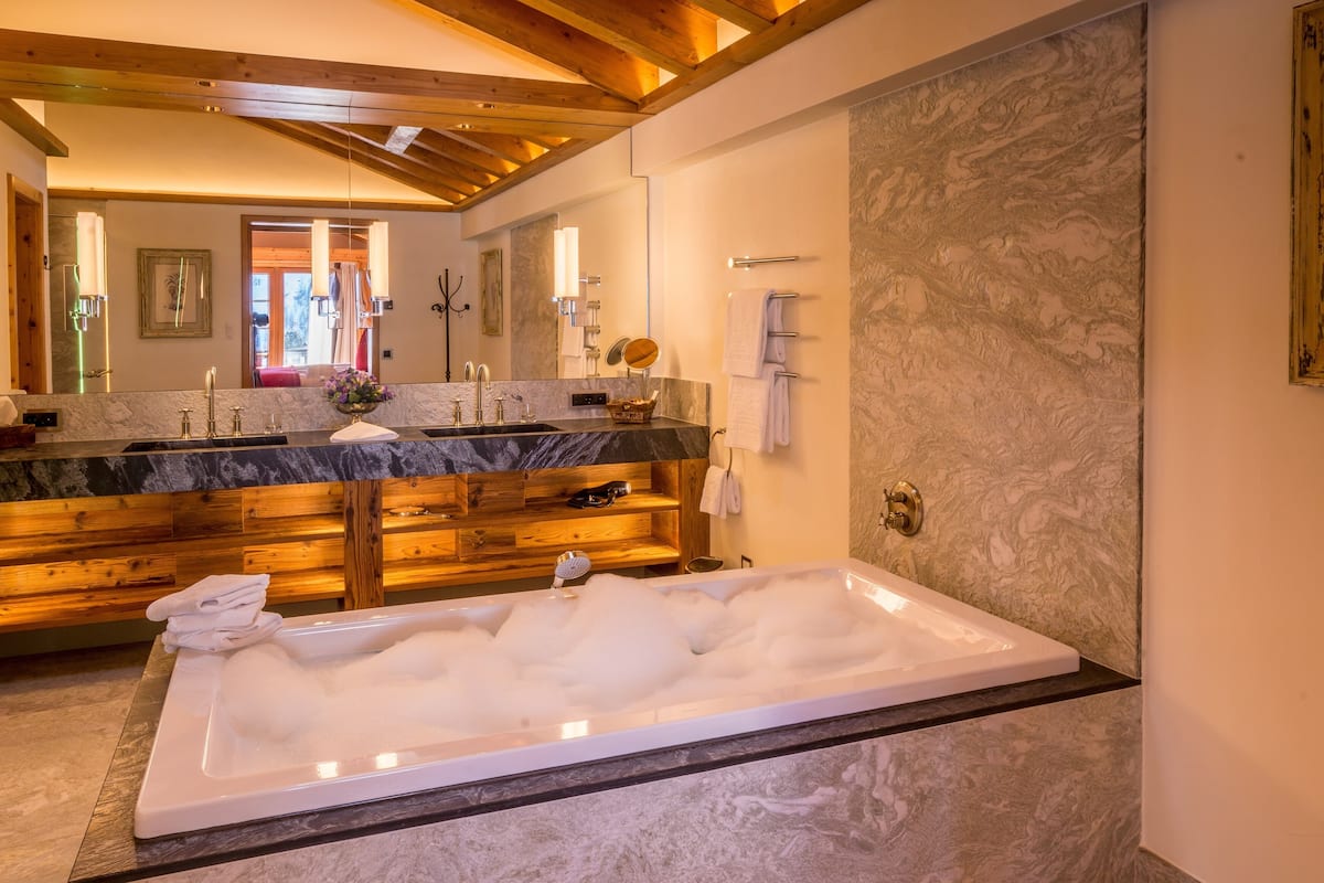 designer toiletries, hair dryer, bathrobes, slippers