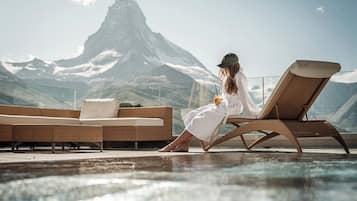 Indoor pool, outdoor pool, pool umbrellas, sun loungers
