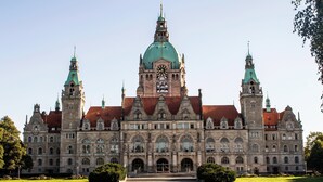 A historic building with a prominent clock tower, arched windows, and a central dome. - YORS Hotel Hannover (Hannover)