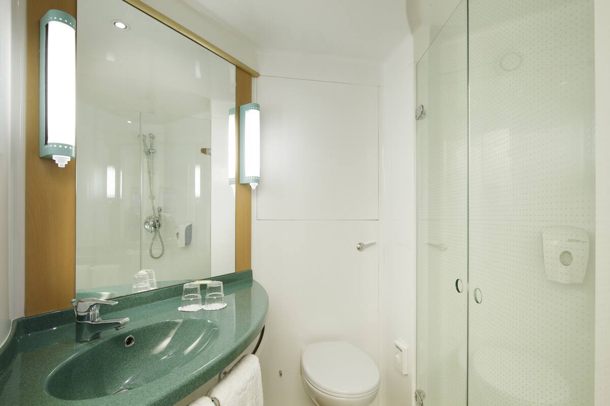 shower, eco-friendly toiletries, hair dryer, towels