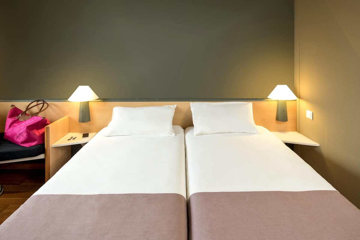 Twin Room, 2 Single Beds | In-room safe, desk, free WiFi, bed sheets