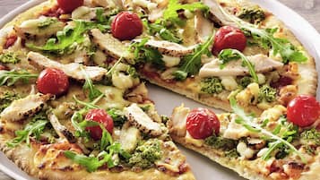 A pizza with various toppings.