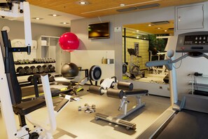 Stay fit on the go with our fully equipped gym featuring a treadmill, bench press, and free weights.