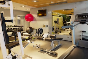 Stay fit on the go with our fully equipped gym featuring a treadmill, bench press, and free weights.