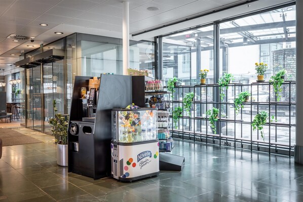Enjoy the urban views from this modern space with a vending machine and large windows.