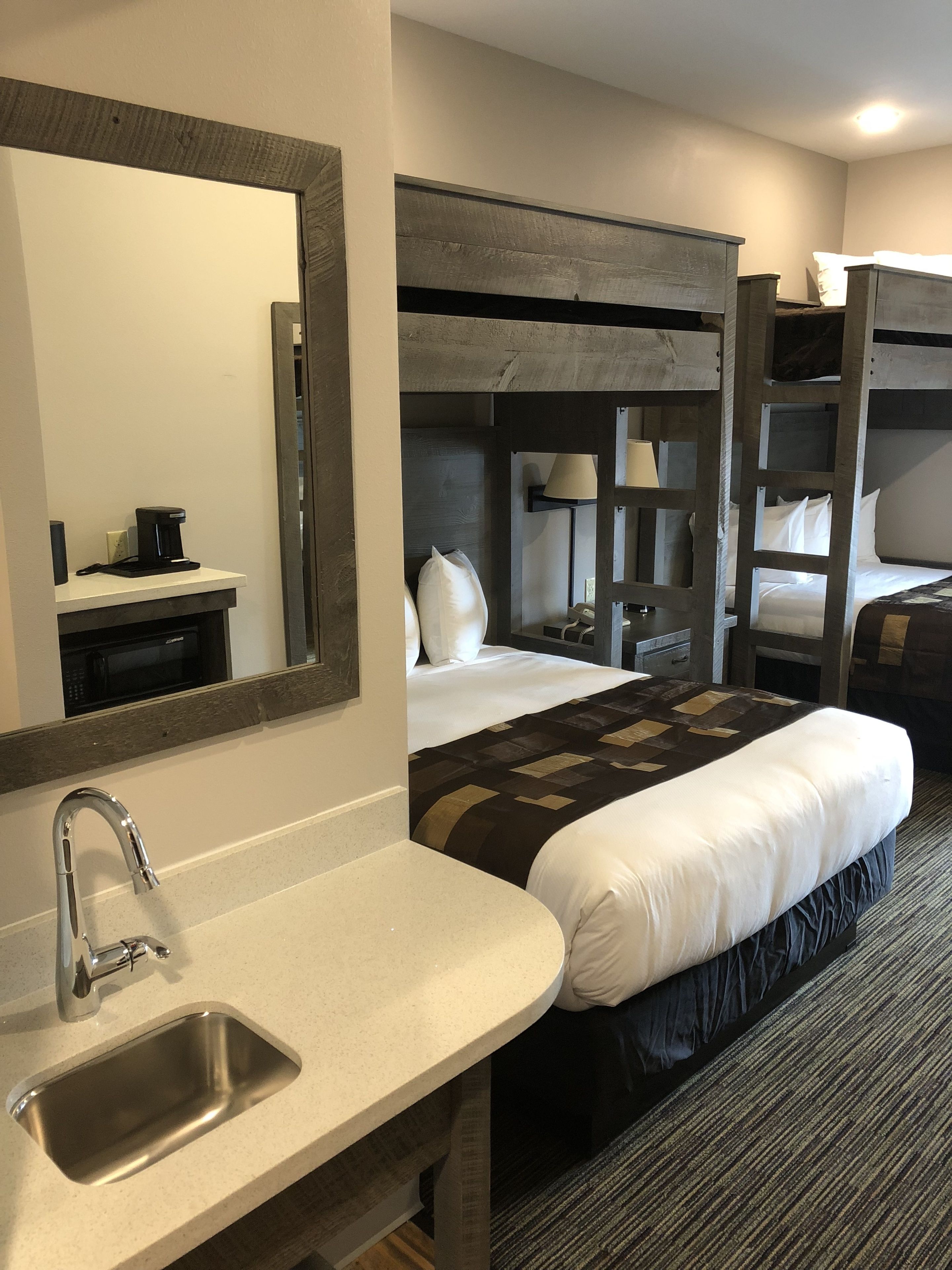 standard room, multiple beds (two queens beds with bunks over top g) | blackout curtains, iron/ironing board, free wifi, bed sheets