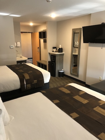 Standard Room, 2 Queen Beds (Two Queen Beds Grizzly Building) | Blackout drapes, iron/ironing board, free WiFi, bed sheets. Kelly Inn West Yellowstone