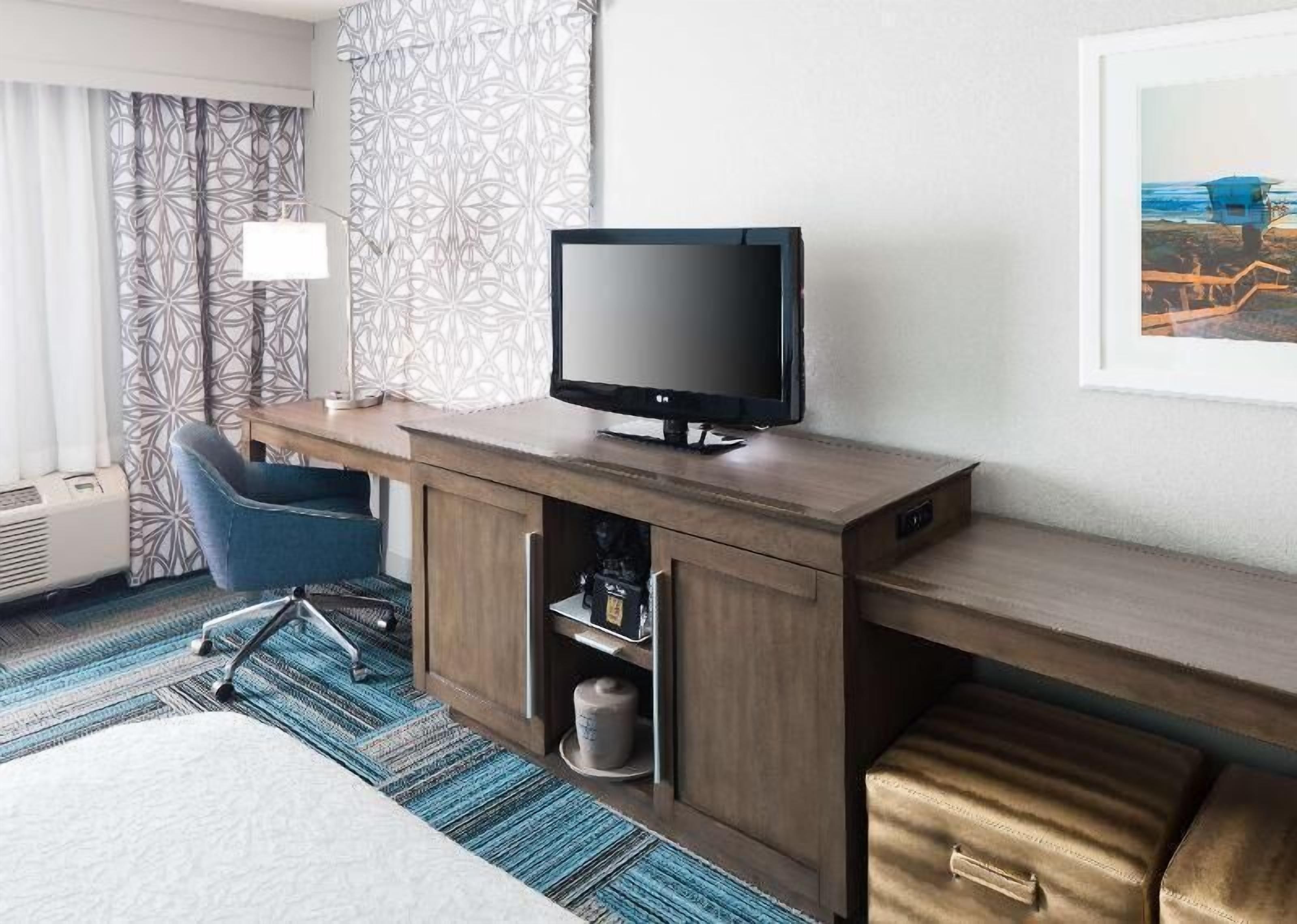 Premium bedding, pillow-top beds, desk, laptop workspace