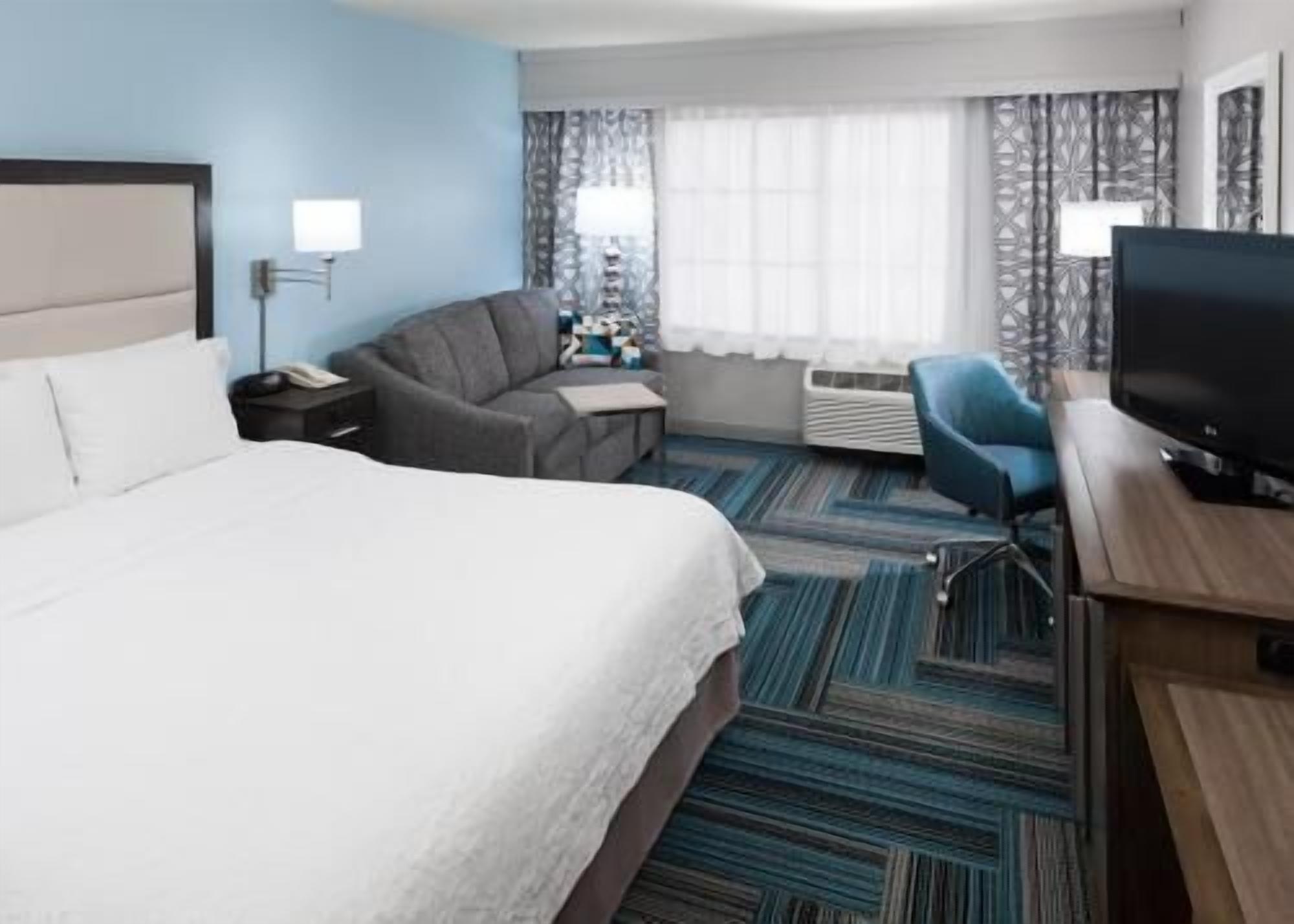 Premium bedding, pillow-top beds, desk, laptop workspace