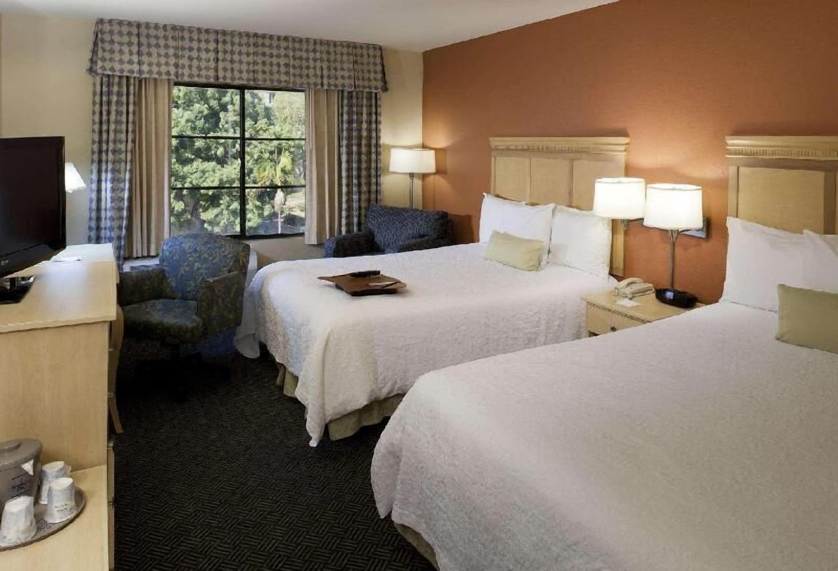 Premium bedding, pillow-top beds, desk, laptop workspace