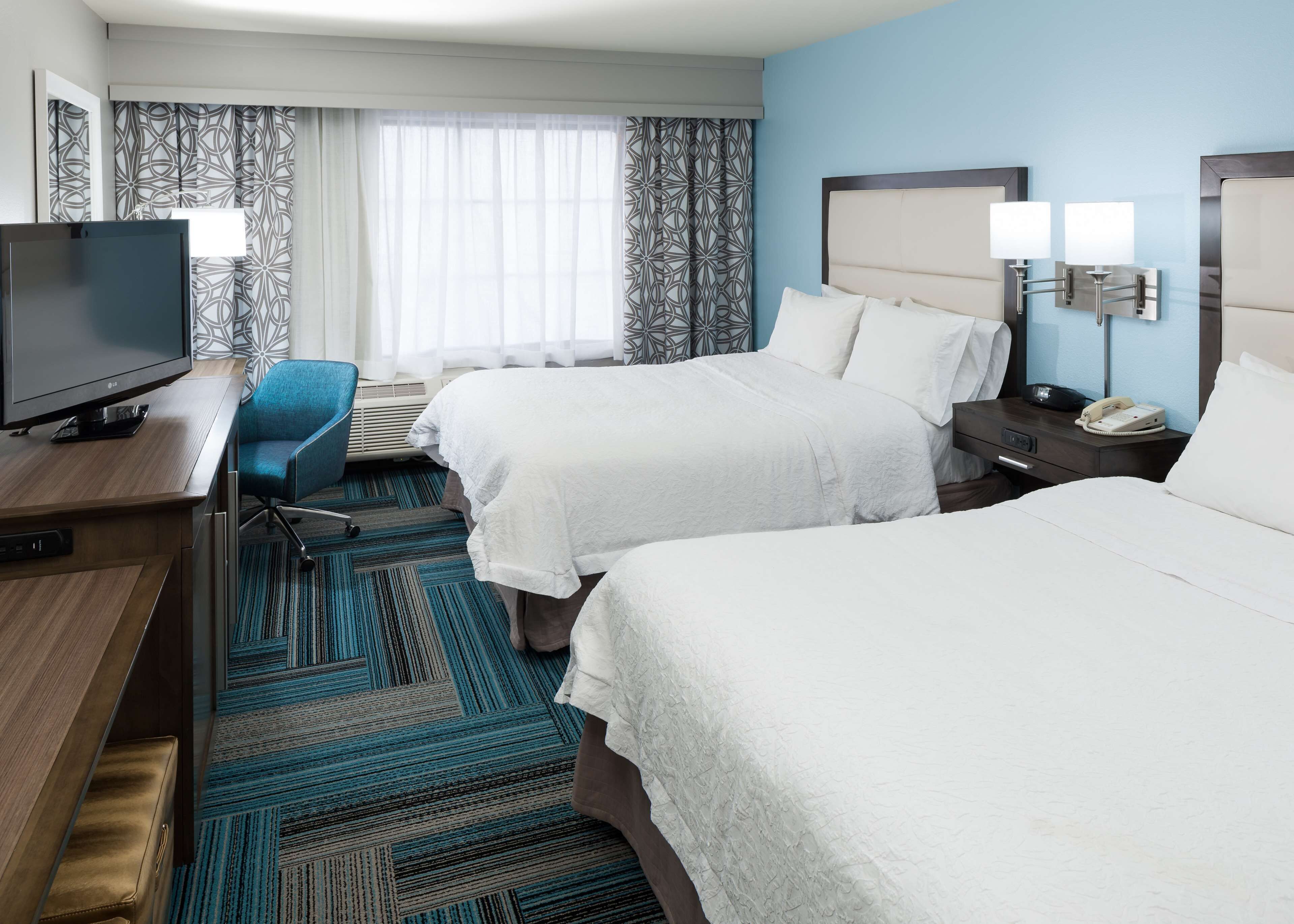 Premium bedding, pillow-top beds, desk, laptop workspace