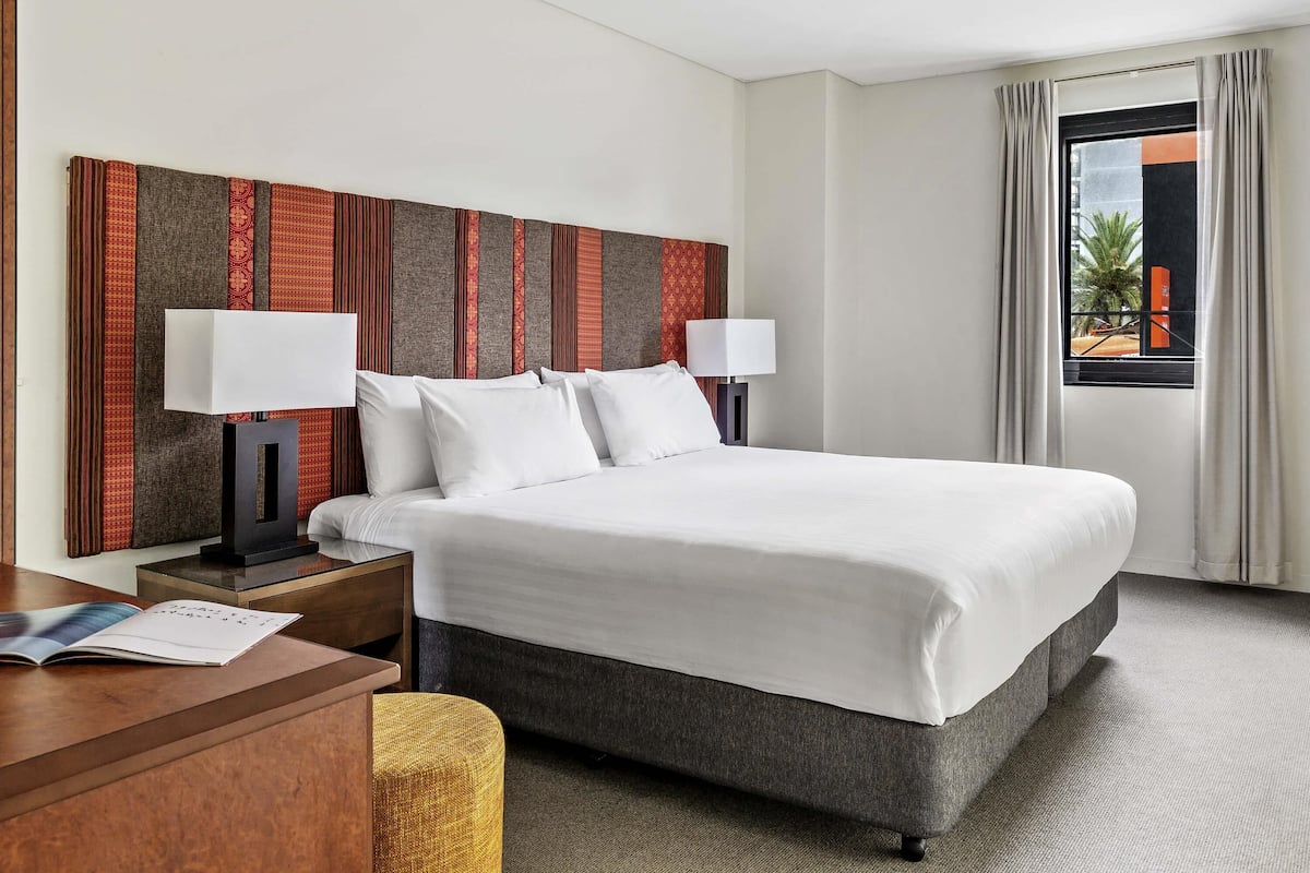 One Bedroom Apartment with King bed, balcony, non-smoking | In-room safe, desk, laptop workspace, blackout drapes