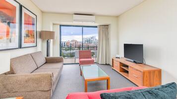 Apartment, 2 Bedrooms, Balcony | Living area | Flat-screen TV