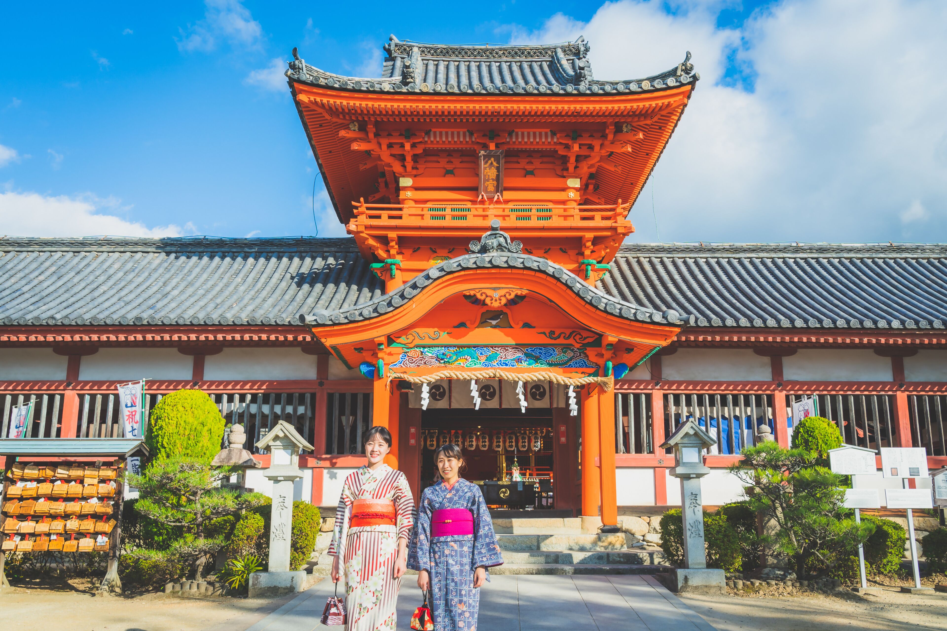 A traditional Japanese building with a tiled roof and ornate entrance.