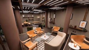Un área de estar moderna con muebles de madera, una mesa central y una alfombra estampada.