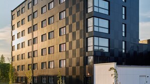 A modern building with the name 'Scandic' prominently displayed on its facade. - Scandic Luleå (Luleå)