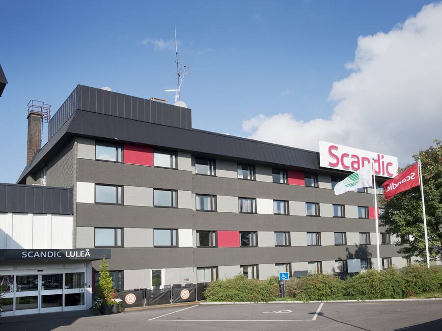 A multi-story building with a sign reading "Scandic Luleå".