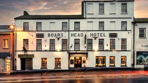 A two-story building with the sign "Boar's Head Hotel" and "Hotel Car Park" indicating it is a hotel with a car park. - Boars Head Hotel (Carmarthen)