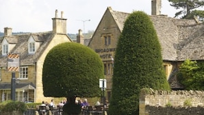 A traditional stone building with a sign reading "Broadway Hotel." - The Broadway Hotel (Broadway)