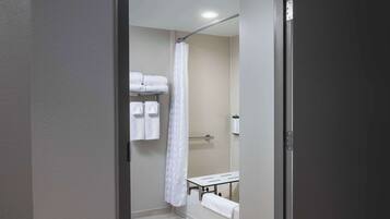 Combined shower/bathtub, designer toiletries, hair dryer, towels