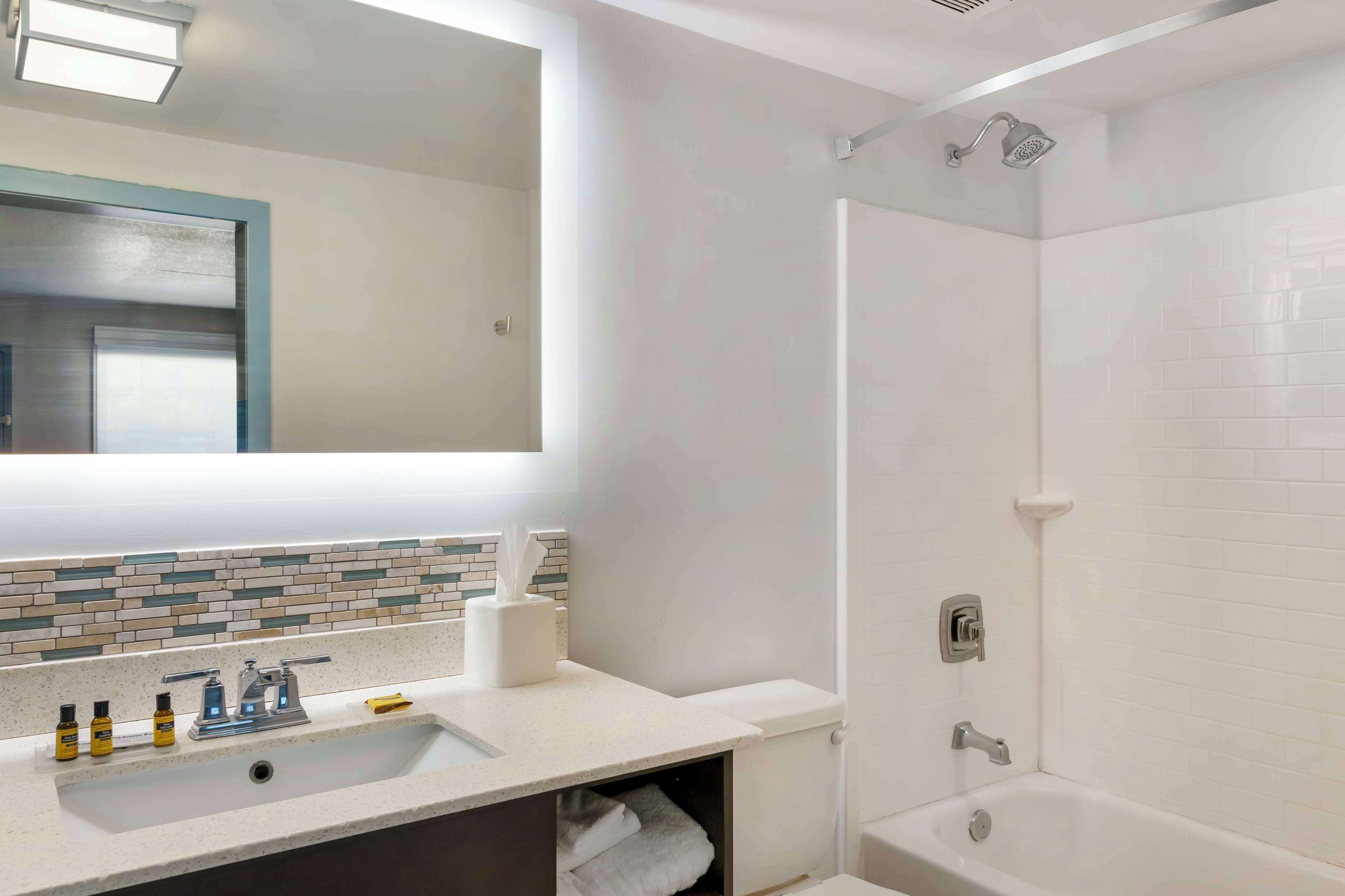 suite, 2 queen beds, non smoking, refrigerator | bathroom | combined shower/bathtub, free toiletries, hair dryer, towels