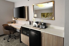 Premium bedding, desk, laptop workspace, blackout drapes