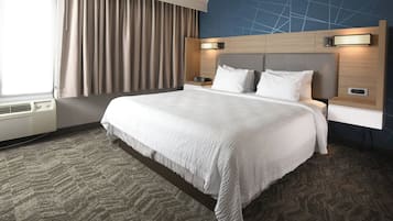 Premium bedding, desk, laptop workspace, blackout curtains