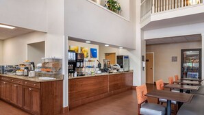A hotel lobby with a coffee station, seating area, and a vending machine. - Comfort Suites Elkhart North (Elkhart)