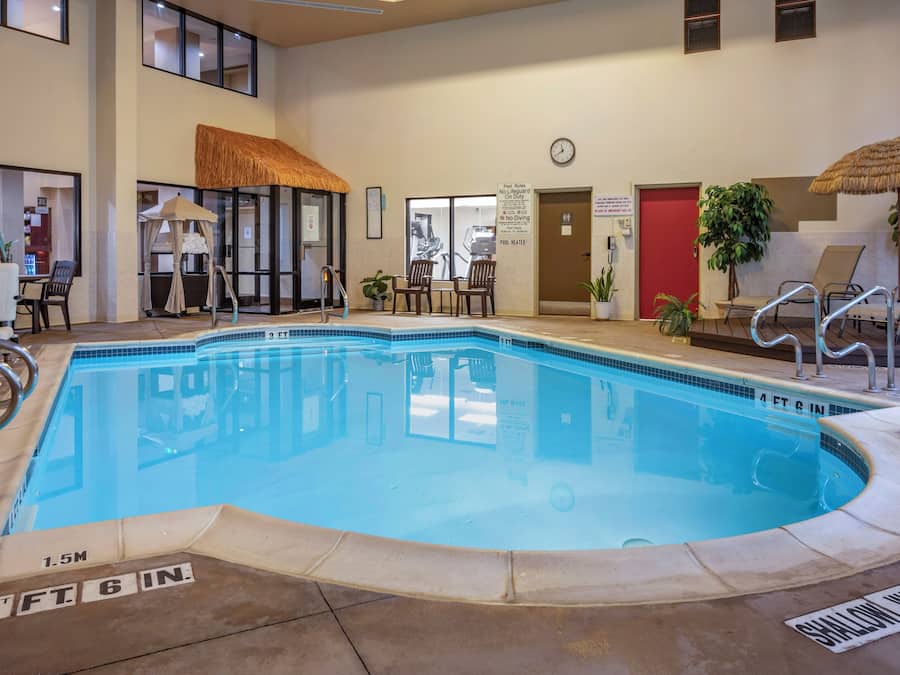 Indoor pool, open 8:00 AM to 10:00 PM, pool loungers