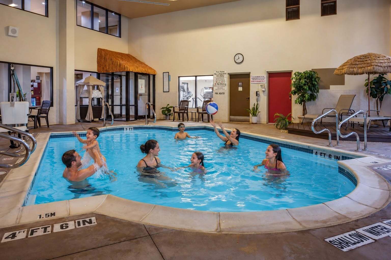 Indoor pool, open 8:00 AM to 10:00 PM, pool loungers