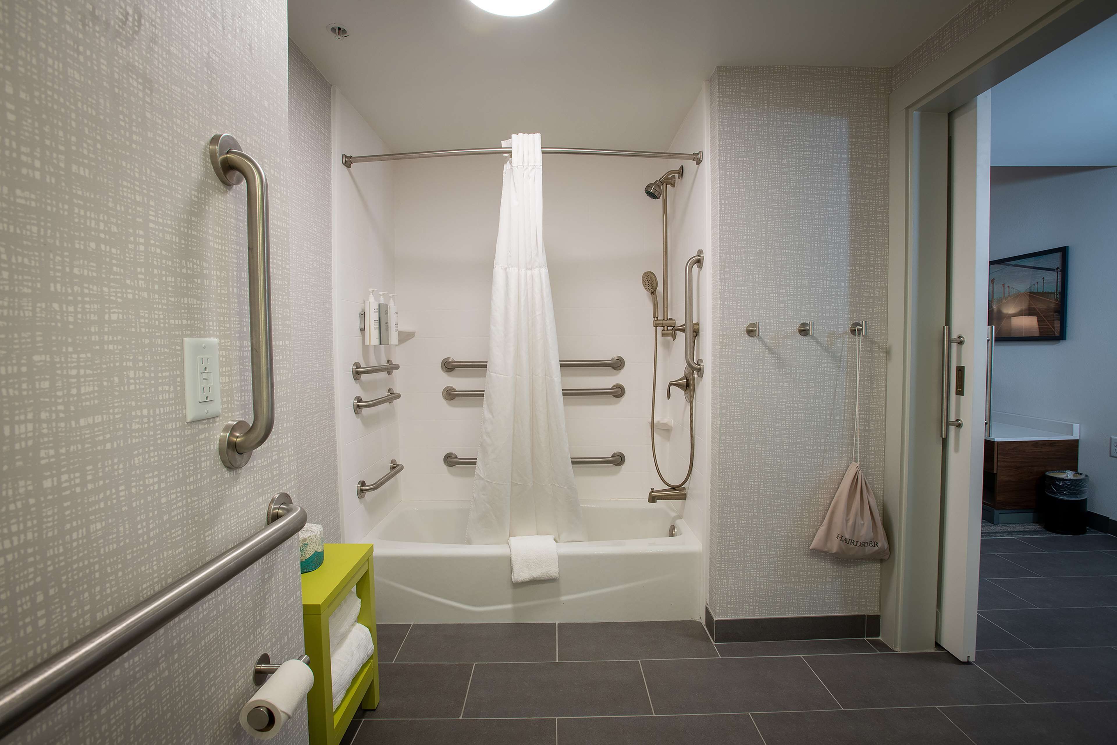 bathtub, hair dryer, towels