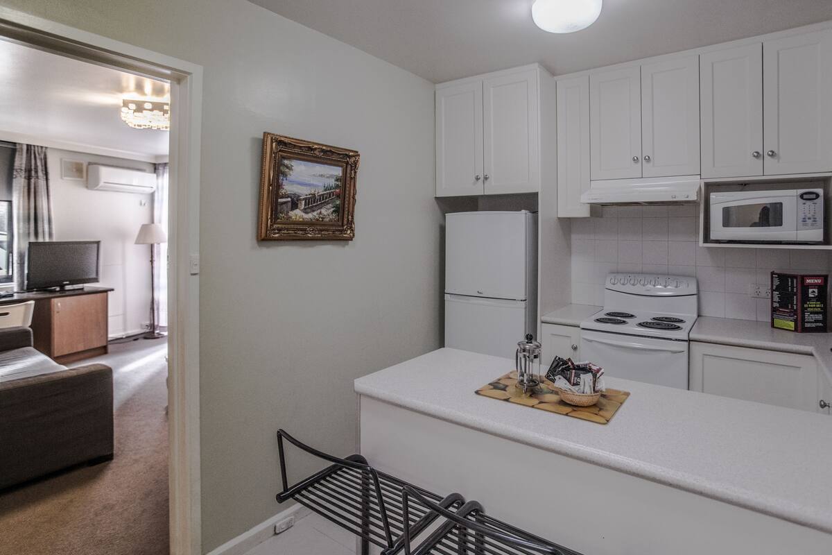 Standard Two Bedroom Apartment | Private kitchen | Fridge, microwave, stovetop, coffee/tea maker