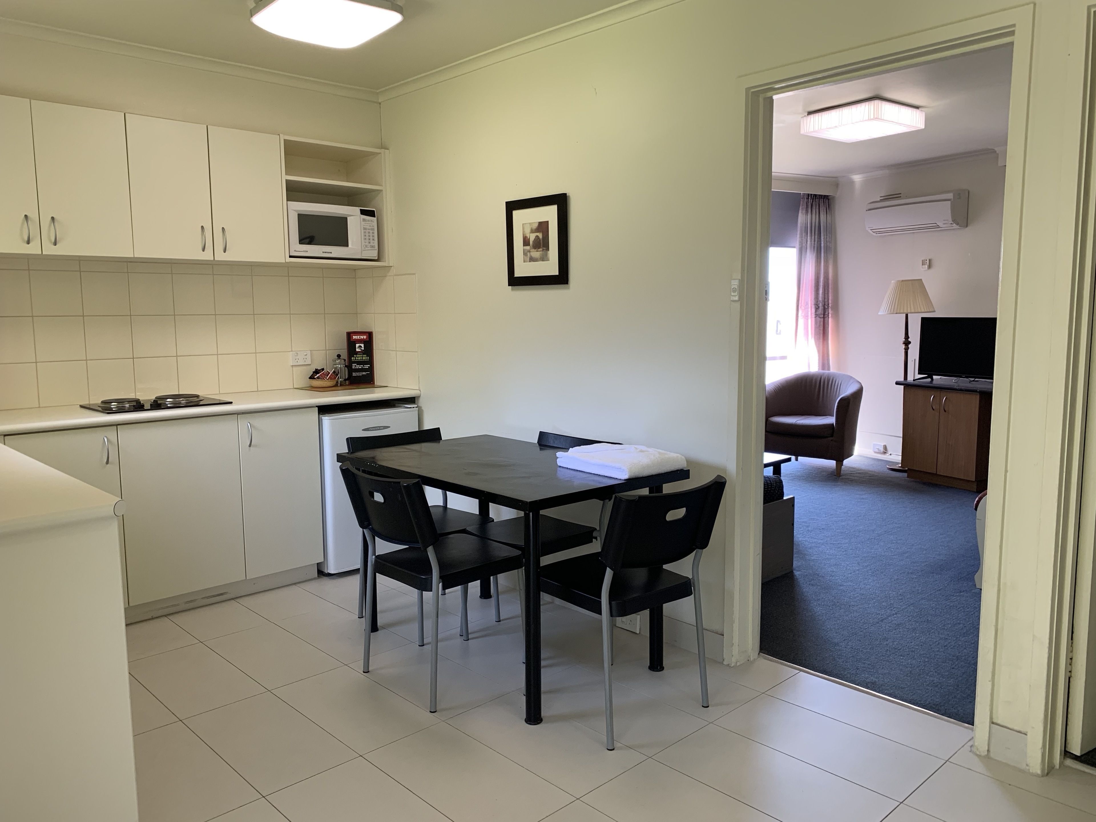 Standard One Bedroom Apartment - Queen | Private kitchen | Fridge, microwave, stovetop, coffee/tea maker