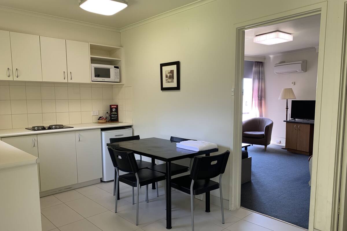 Standard One Bedroom Apartment - Queen | Private kitchen | Fridge, microwave, stovetop, coffee/tea maker