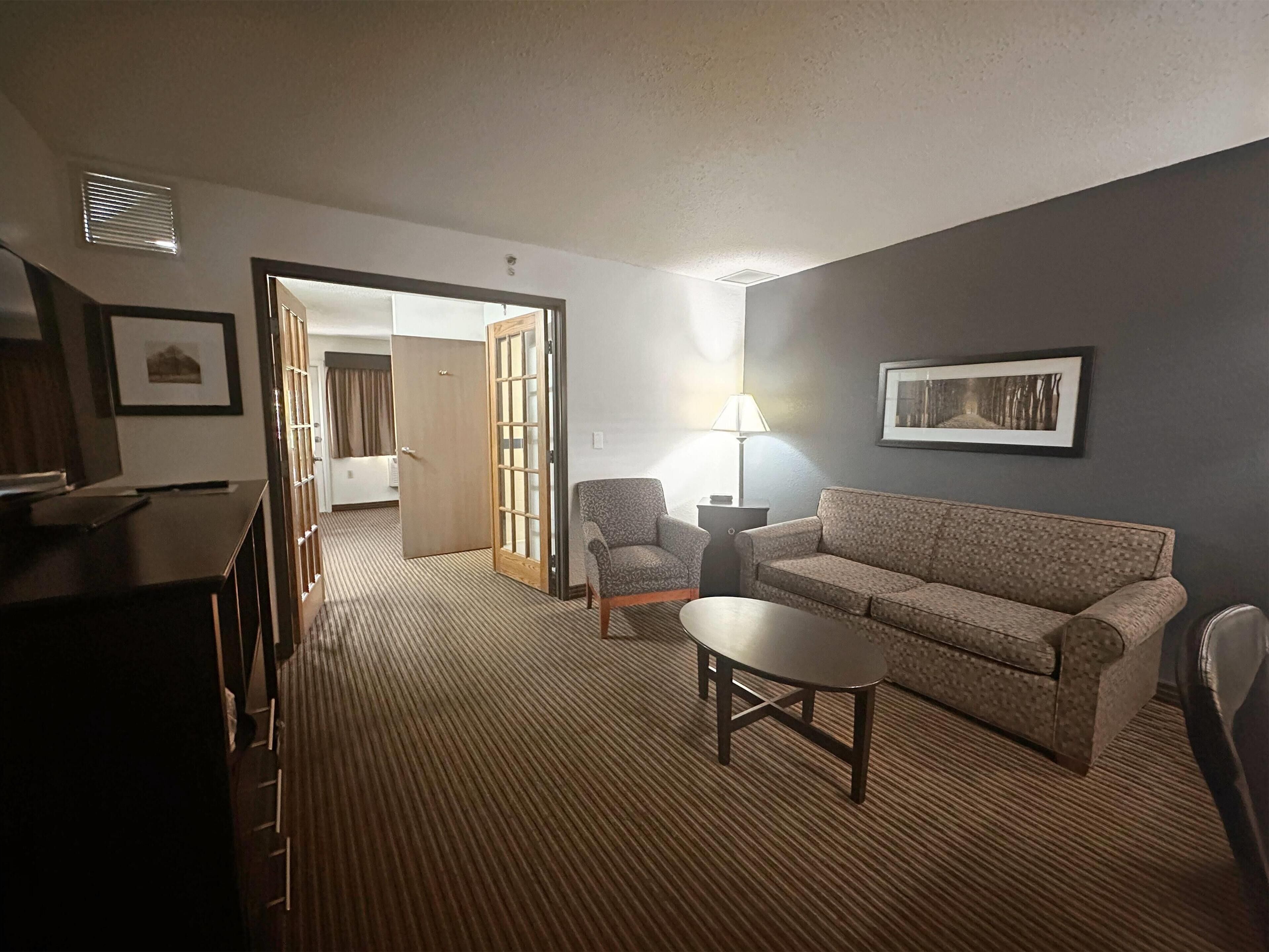 Suite, 1 Queen Bed, Non Smoking | Desk, iron/ironing board, free cribs/infant beds, rollaway beds