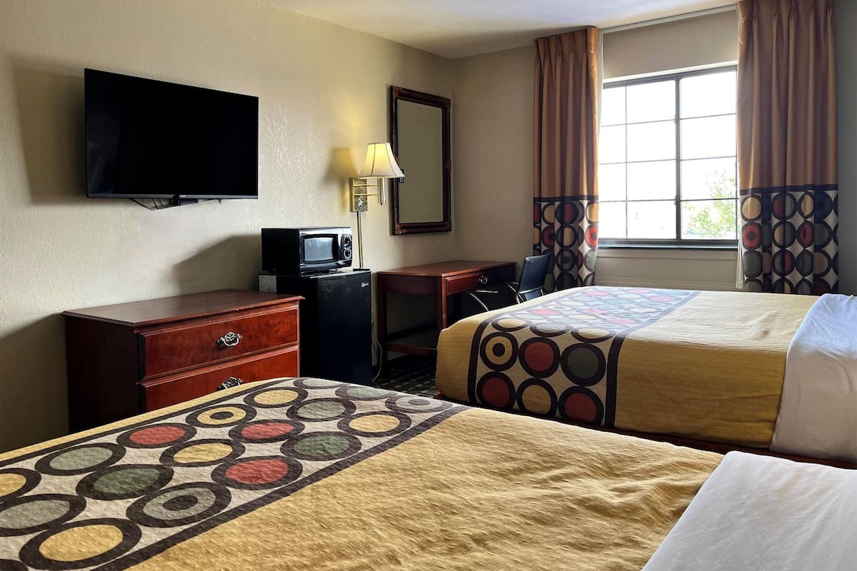 Desk, laptop workspace, blackout drapes, iron/ironing board