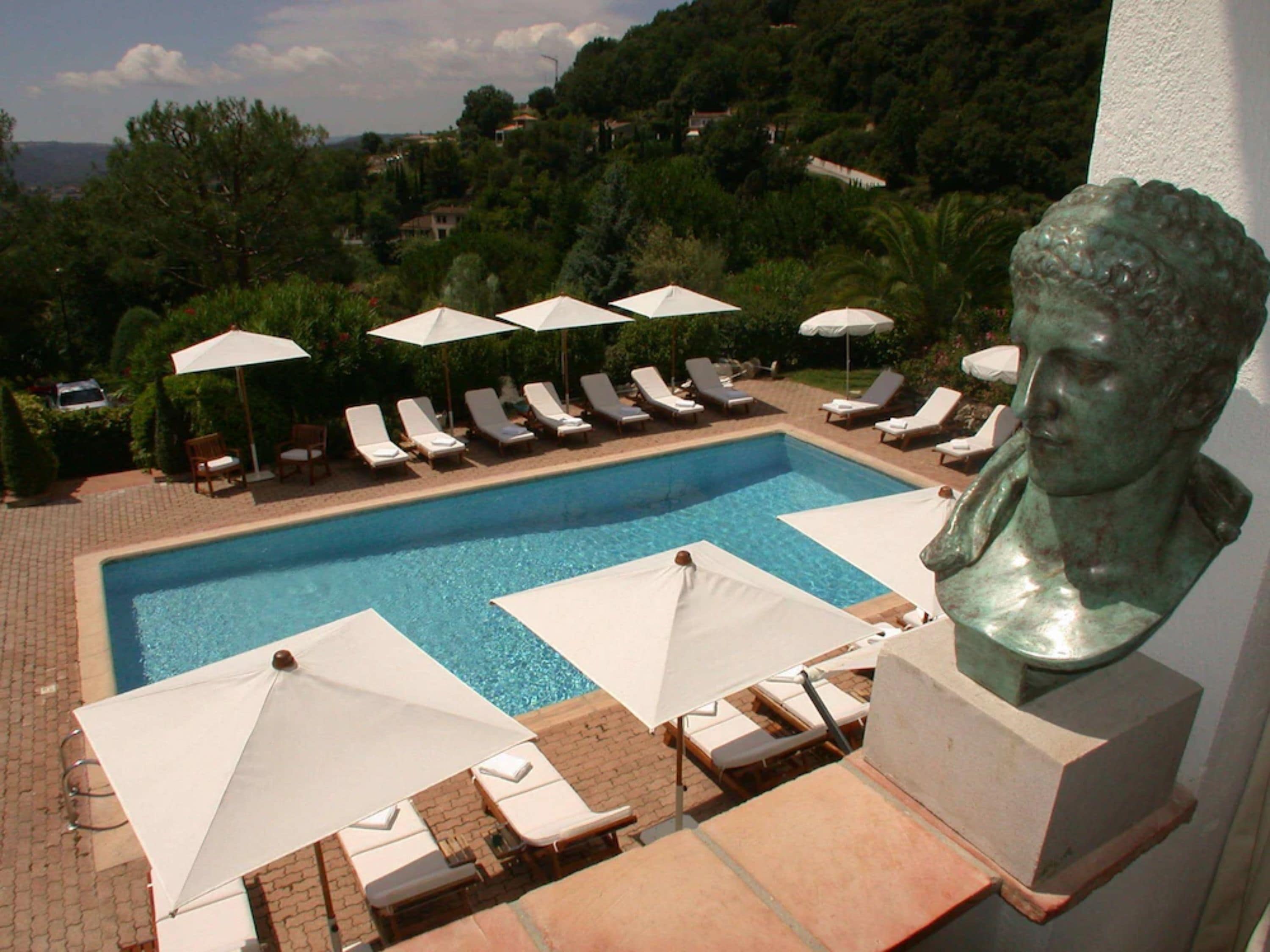 Outdoor pool, open 8:00 AM to 9:00 PM, pool umbrellas, pool loungers