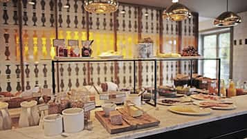 A breakfast buffet with various food items and condiments.